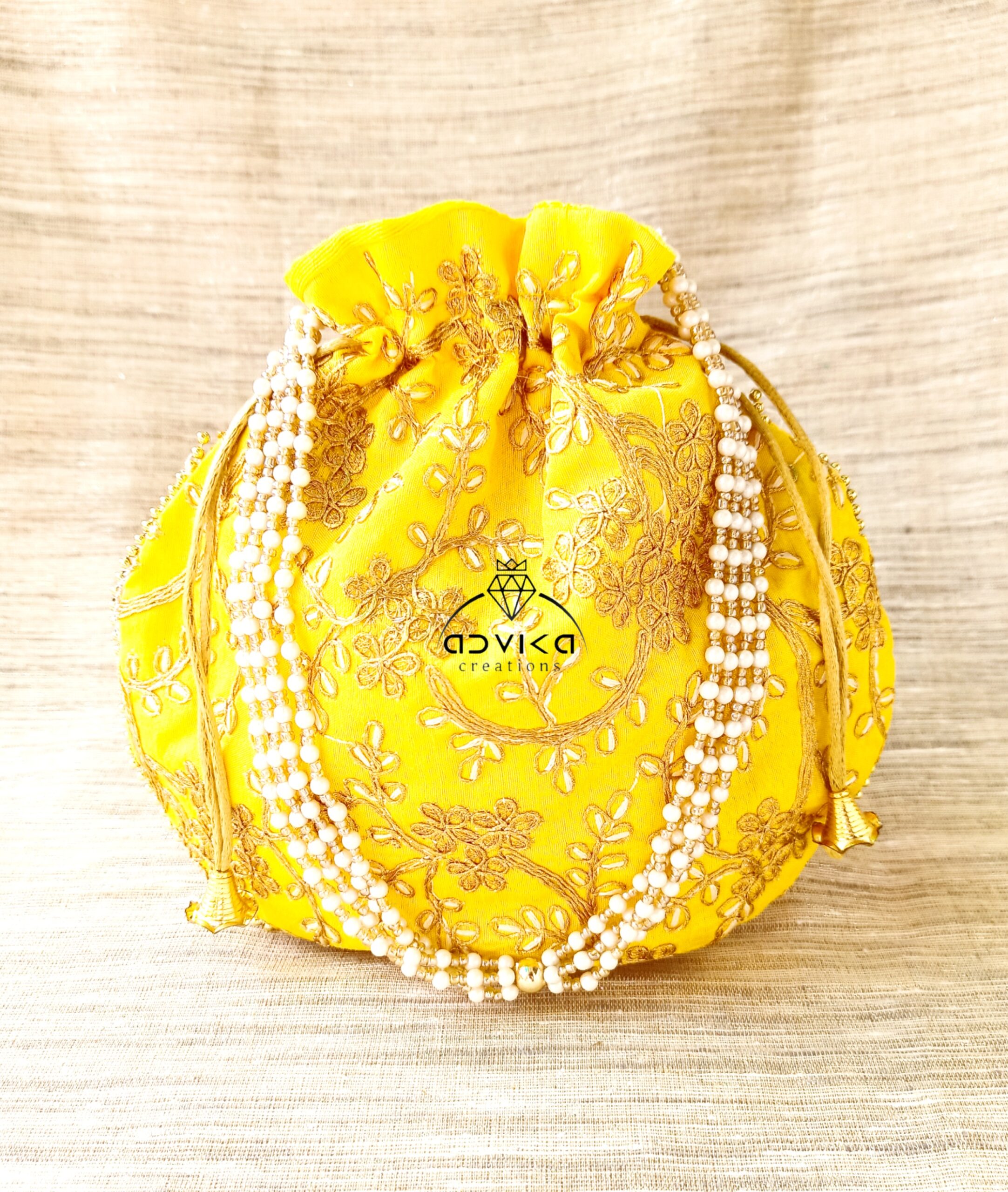 Beautiful Zari work with pearl hanging bag