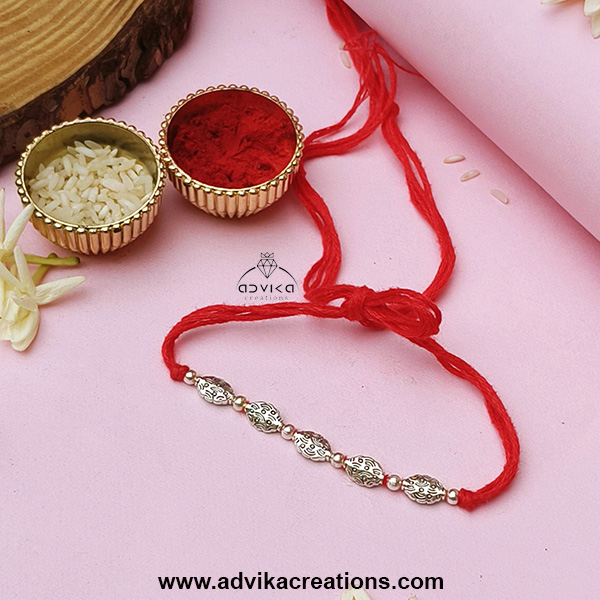 Elegant Silver Charms Rakhi