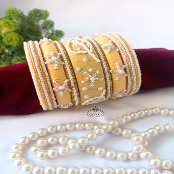 Pastel yellow beaded handstiched festive bangles set