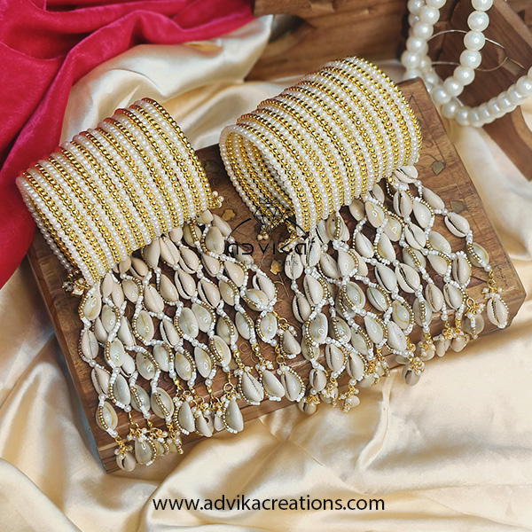 Beautiful handcuffs with cowrie shell hangings