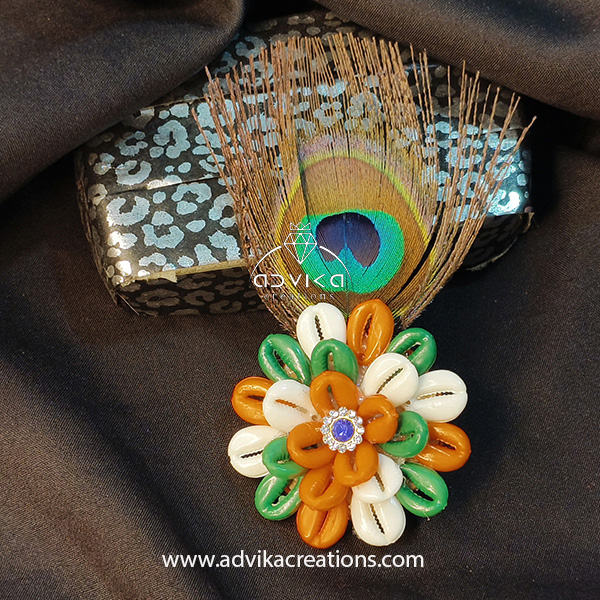 colorful cowrie flower brooch with peacock feather