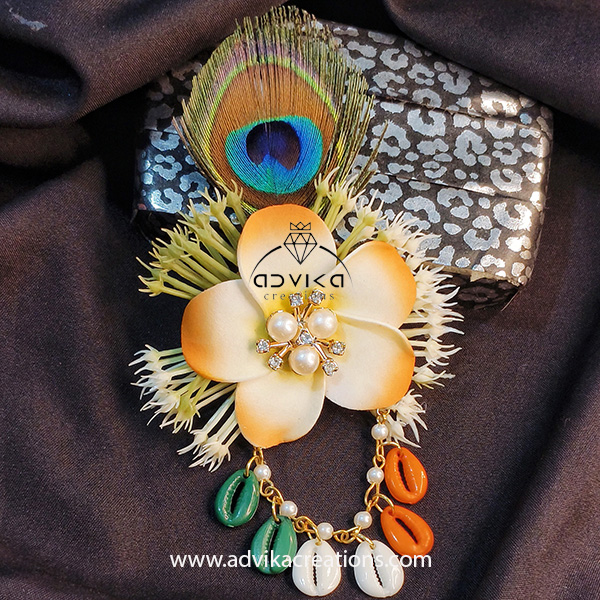elegant flower brooch with peacock feather
