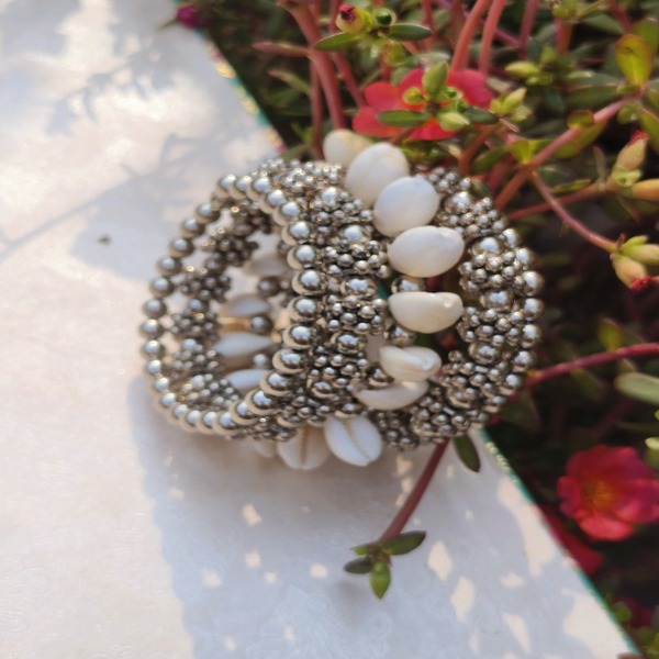 bracelet with Silver beads paired with a small cowrie